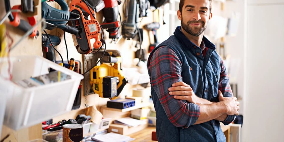 Confident provider standing in his workshop